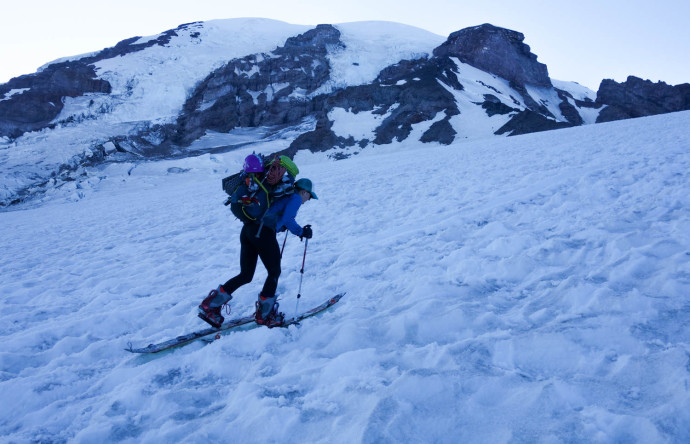 Katy skinning up Muir Snowfield. The iced-over suncups made for less-than-stellar traveling. 