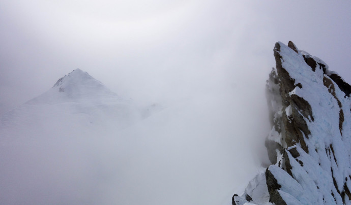 Sherman Peak appearing out of the steam from Mt Baker's crater. Taken from the Crater rim. 