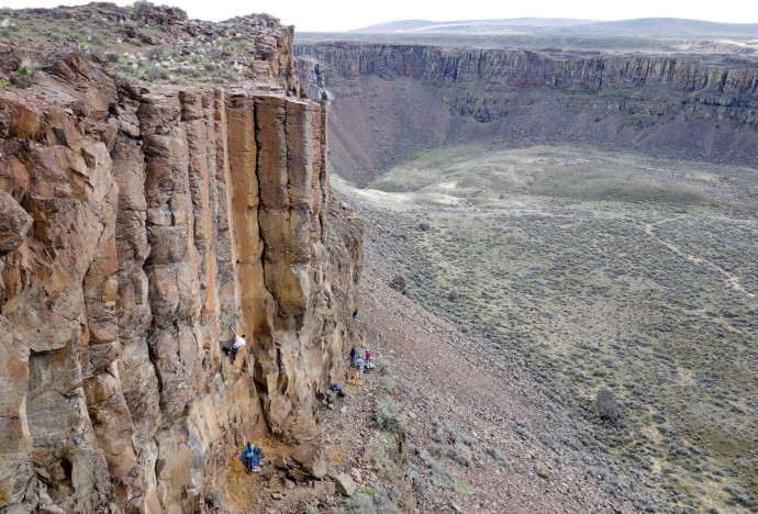 A climber moving up a route on Sunshine Wall.