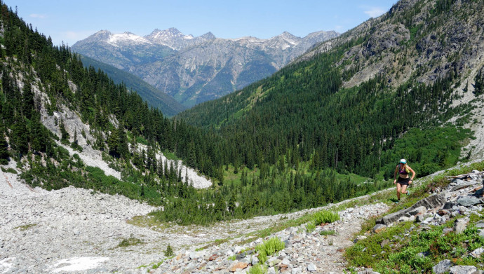 Katy running down the pass past Rainbow Lake. 