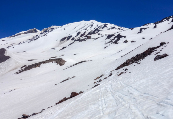 The easier part of making it back to the trail -- traversing over snow. Some rocky ridges would make this more fun. SW Chutes follow the snow between the rock-ridges in center of the image.