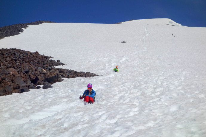 Erin and Katy coming down the glissade chute - it was fast! I still prefer snowboarding down.