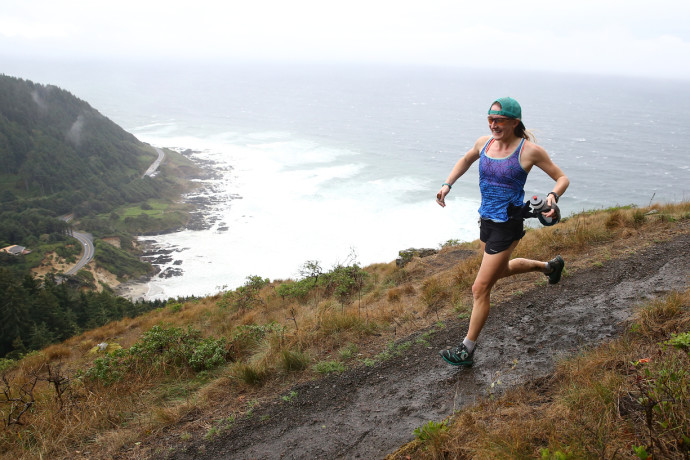 Battling the wind and rain at Cape Perpetua with a grin. Thanks to Glen Tachiyama for capturing it! Check out the rest of his incredible race photos here.