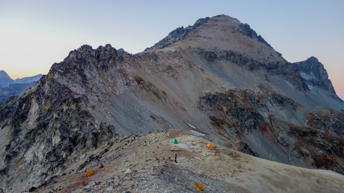 Maude and our camp at sunset. Another couple tents were set up shortly after this as well. We're the orange tent. srcset=